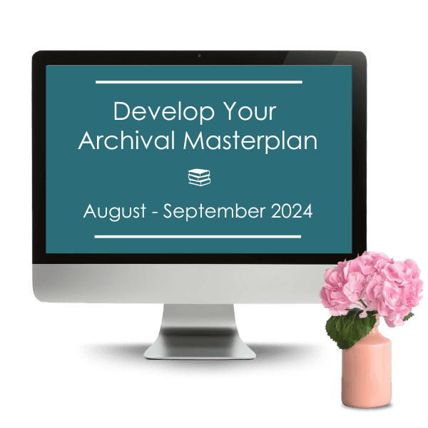 A computer screen displaying the text "Develop Your Archival Masterplan, August - September 2024" beside a small vase with pink flowers.